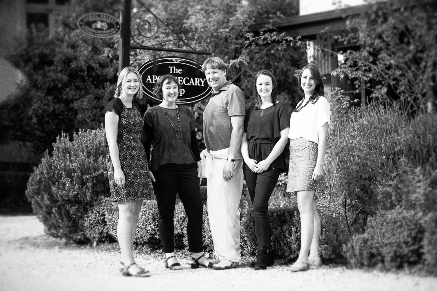 Carol and her family in front of CAROL PRIEST Factory